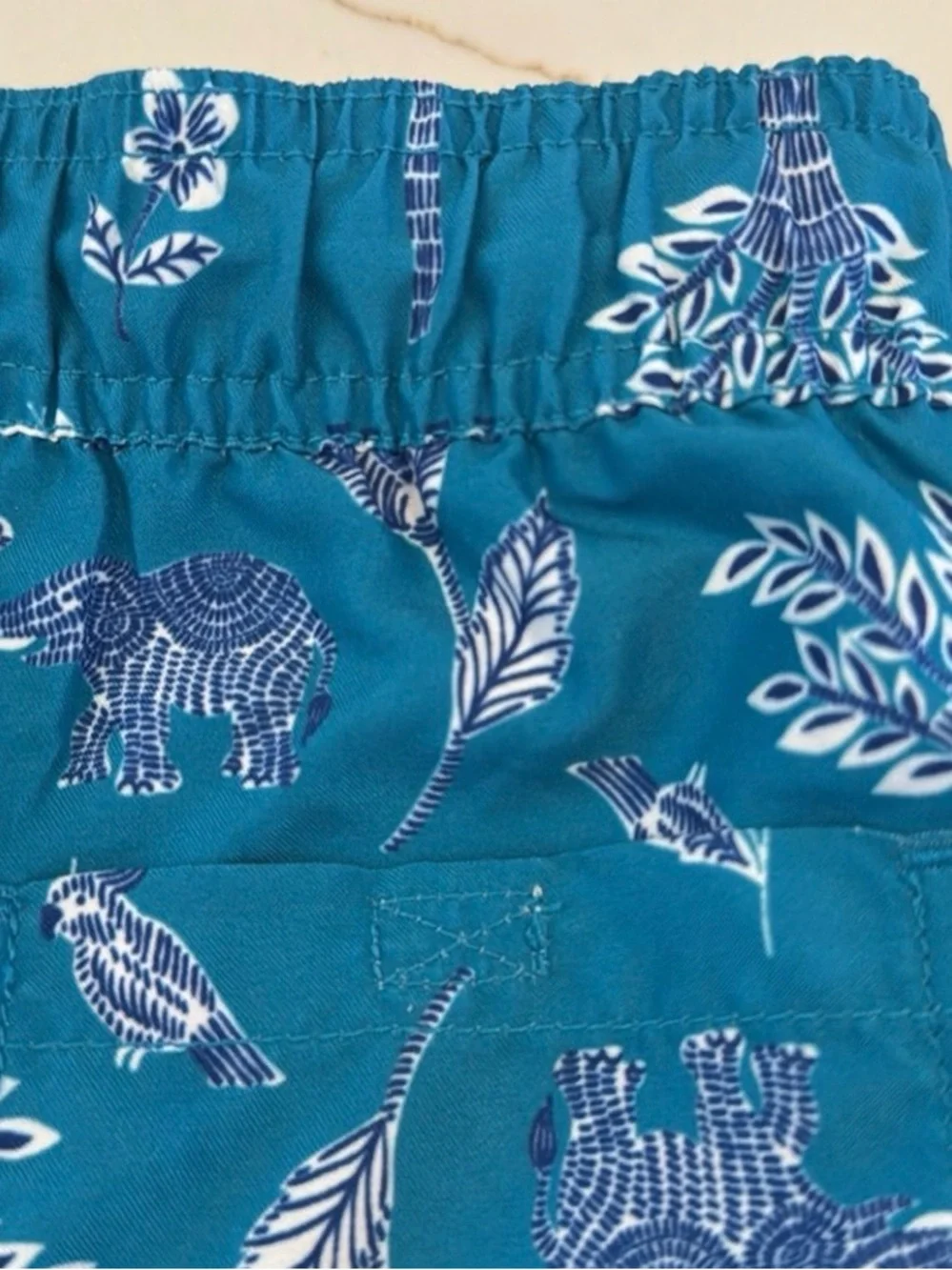 Janie and Jack Teal World Love Swim Trunks with Animal Print